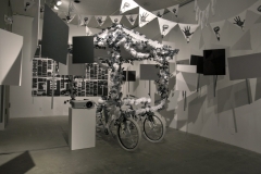 The Pacific Electric Railway Strike of 1903, installation view with remade turn of the century float, video, picket signs, pennants and redacted poems, 2018